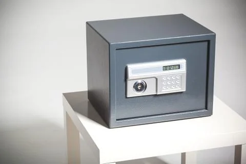 Closed safe on grey background Stock Photos