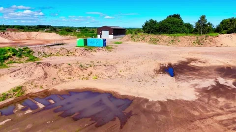 Closed Sand Quarry With Containers, Building and Rural Access Road, Aerial view Video stock 335685227
