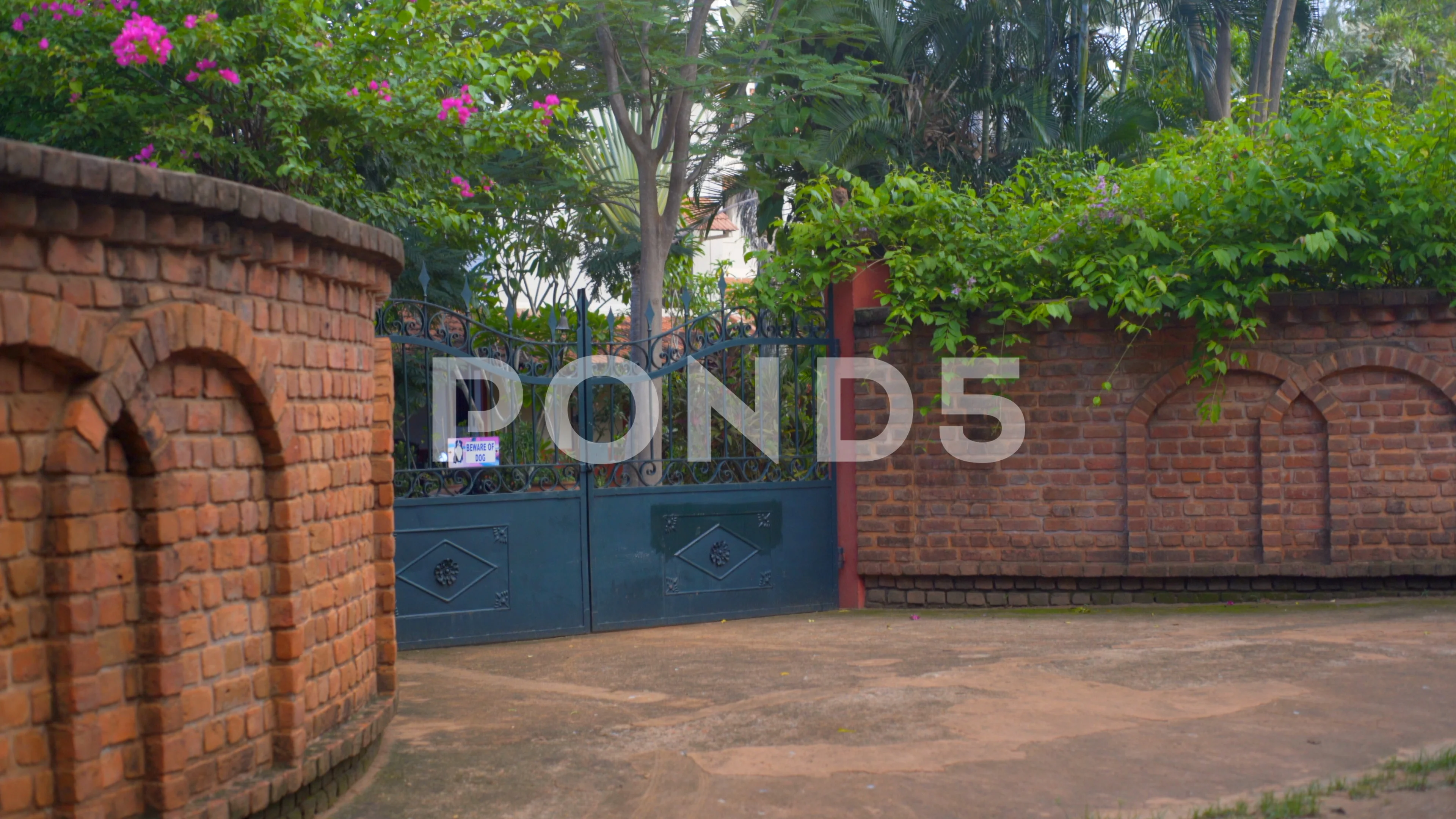 Closed security gate private wealthy residence Auroville India