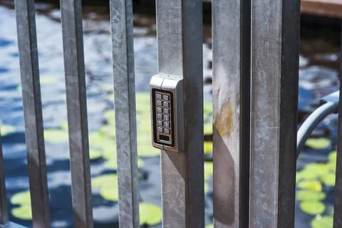 Closed server cabinets with an electronic sensor on the door. Stock Photos