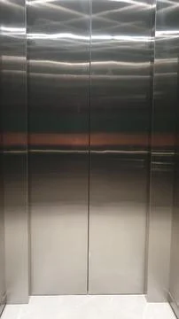 Closed shiny stainless steel elevator 스톡 사진