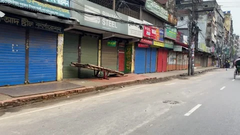 Closed shop, row of shuttered storefronts along empty city street during Stock Footage 340913982