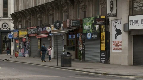 Closed shops next to Piccadilly Circus during Lockdown London Stock Footage 129717373