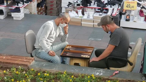 Closed shops, vendors play backgammon on the street. Antalya, Turkey. Stockbeeldmateriaal 146958581