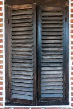 Closed shutter blinds on brick wall Stock Photos