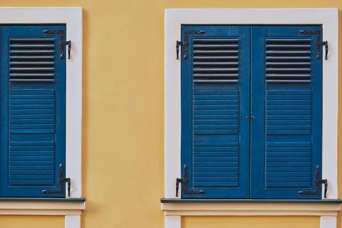 Closed shutters on windows closeup Stock Photos