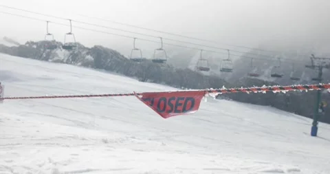 Closed Sign Blowing In Wind At Top of Ski Run Winter Covid 19 Shutdown Stock Footage 137840464