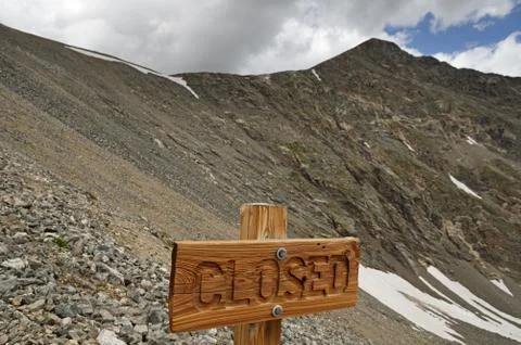 Closed Sign In Front Of Mountain Stock Photos