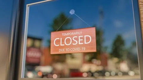 Closed Sign on Shop Window. Store sign. Close-up on a closed sign in the window Ilustración de archivo