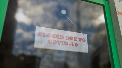 Closed Sign on Shop Window. Store sign. Close-up on a closed sign in the window Ilustración de archivo