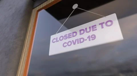 Closed Sign on Shop Window. Store sign. Close-up on a closed sign in the window Ilustración de archivo