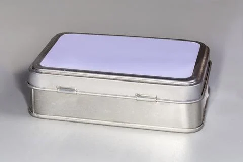 Closed small tin box to store various small household items Foto stock