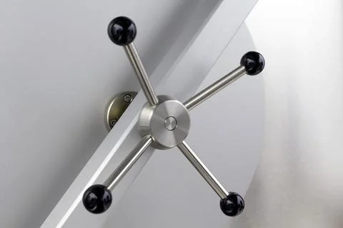 The closed solid bank vault iron door Stock Photos