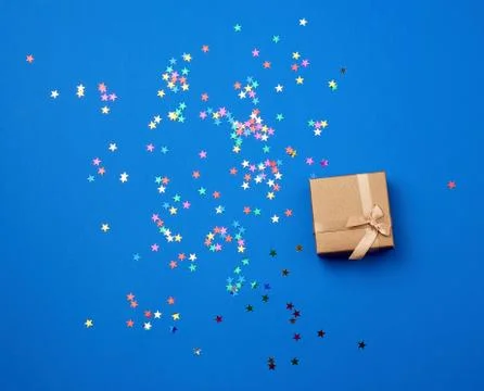 Closed square empty gift box on a blue background 스톡 사진