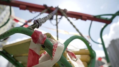 Closed swing in the playground bottom view left motion shot Video stock 131728754