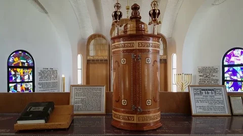 Closed Tora scroll in synagogue, painted glass window, Hebrew script, David star Видео 80266094