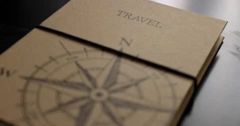 Closed travel book wrapped with string lying on a black table stop travelling Stock Footage 150154780