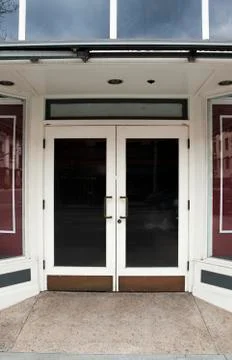 Closed white doors to store 写真素材