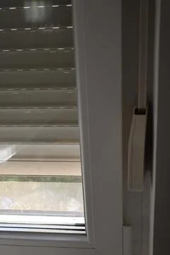 Closed window blind with daylight filtering through Fotos de archivo