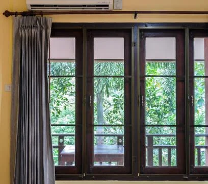 Closed window with curtain Stock Photos