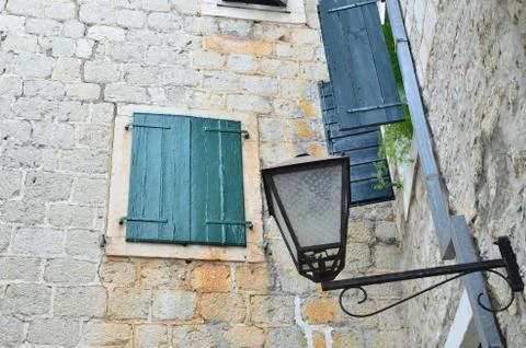 Closed window of a stone house Stock Photos