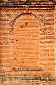 Closed windows in old orange brick wall Stock Photos