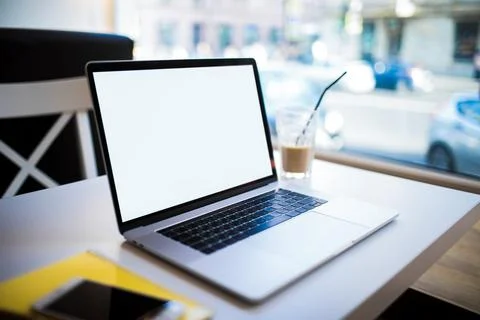 Closely modern laptop computer with white empty copy space screen background  Stock Photos