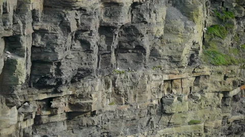 Closer look of the big rocks in Moher Cliffs in  Ireland Stock Footage 68645868