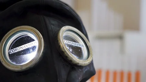 Closer look of the black hazard mask with the coronavirus or Covid-19 Stock Footage 129344964