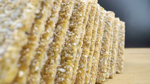 The closer look of the bread crispies on the table Stock Footage 135694505