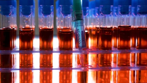 The closer look of the coronavirus or Covid-19 vaccine syringe Видео 129460194