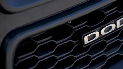 Closer look of the Dodge logo of the black car Stock Footage 121935310