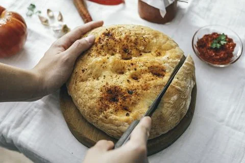 Closer look of Focaccia bread while slicing. Stock Photos