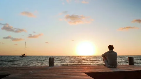 Closer Look at Man Watching the Sunset Stock Footage 75068604