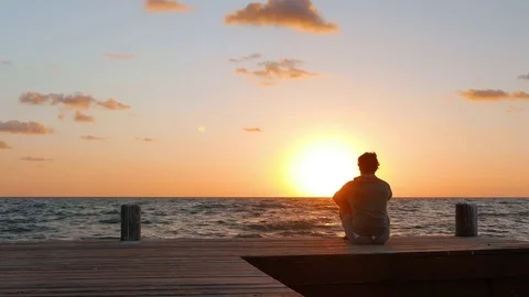 Closer Look at Man Watching the Sunset Stock Footage 75069161