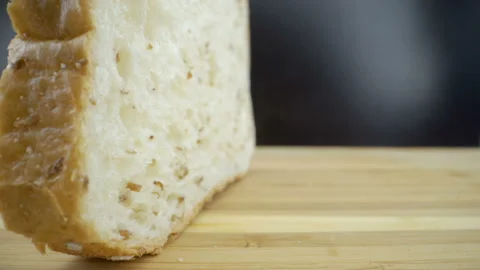 A closer look of the sliced bread on the table Stock Footage 135693637
