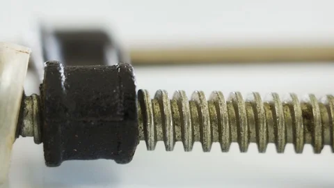 A closer look of the small clamp tool with the yellow capsule medicine Stock Footage 129456640