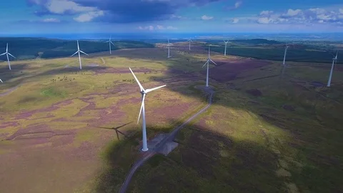 A closer look of the tunring propellers of the windmills in Ireland Stock Footage 70802050