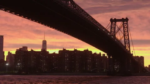 Closer sunset view of downtown NYC under Williamsburg Bridge Stock Footage 346427707