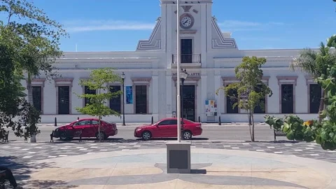 Closer view of building with clocktower and cars. Stock Footage 172384275
