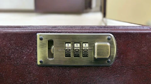 Closes the case with combination lock Stock Footage 80131575