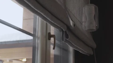 Closes the roller blinds Stock Footage 267970929