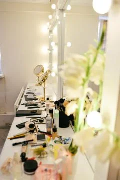 Closet room with make-up vanity table, mirror and cosmetics product in flat Stock Photos