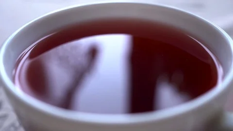 Closeu-up. Reflection in the cup of red tea Stock Footage 73791347