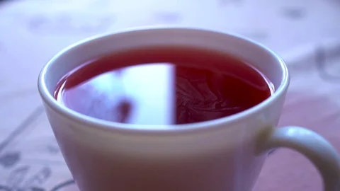 Closeu-up. Reflection in the cup of red tea Stock Footage 73828546