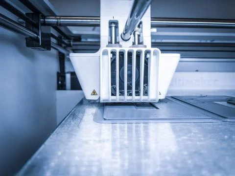 Closeup of a 3D printer with plastic wire filament in additive manufacturing Illustrazione stock
