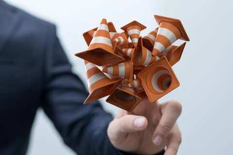 A closeup of a 3D rendered bunch of under construction signs and a man's hand 스톡 사진