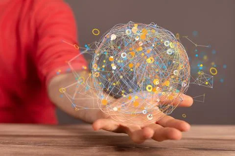 A closeup of a 3D rendered global network icon in a man's hand- neural networ 库存照片