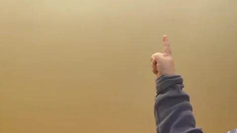 Closeup of 9-10 months old baby boy forefinger pointing up Video stock 82601092