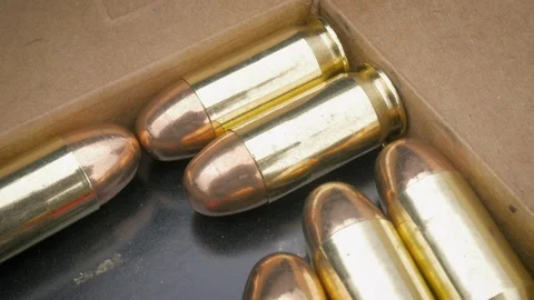 Closeup of 9mm Bullets in an Ammo Box in 4k Stock Footage 88374587